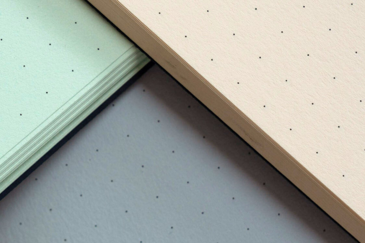 Four different colored textured sheets arranged in a pattern.